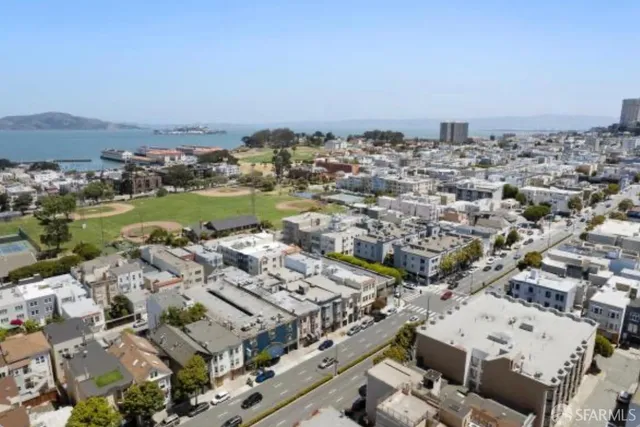an aerial view of a city with lots of residential buildings
