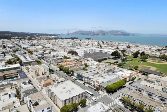 an aerial view of a house with a ocean view