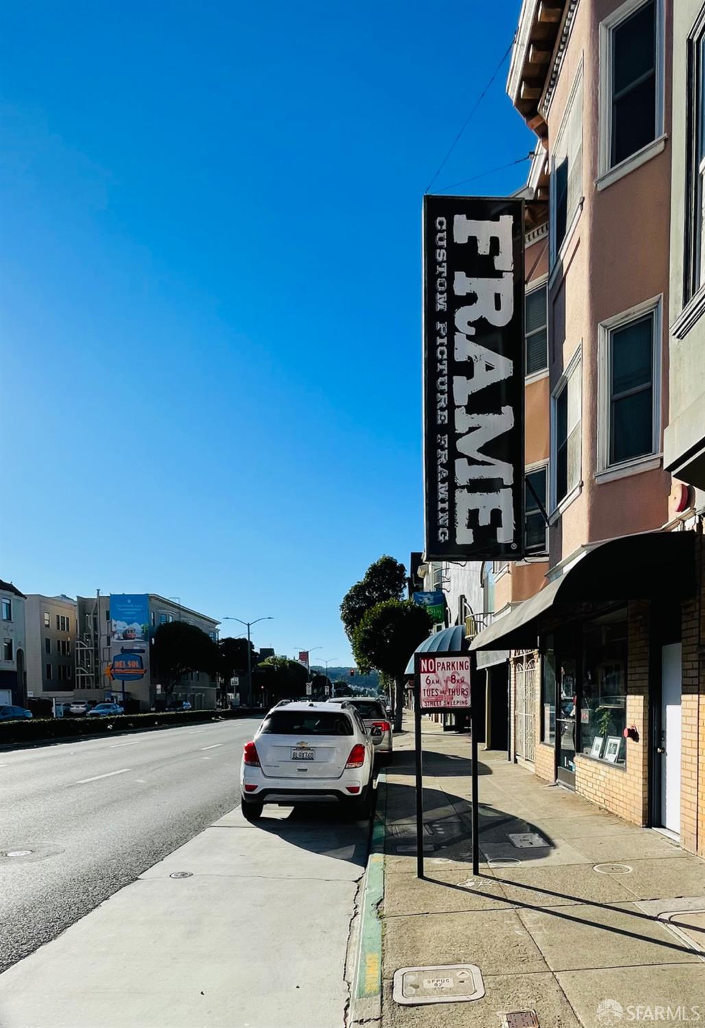 1926-1930 Lombard Street San Francisco, CA 94123 - Photo 3 of 26 a car parked on the side of a street