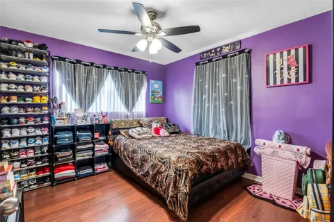 a bedroom with a bed and a book shelf