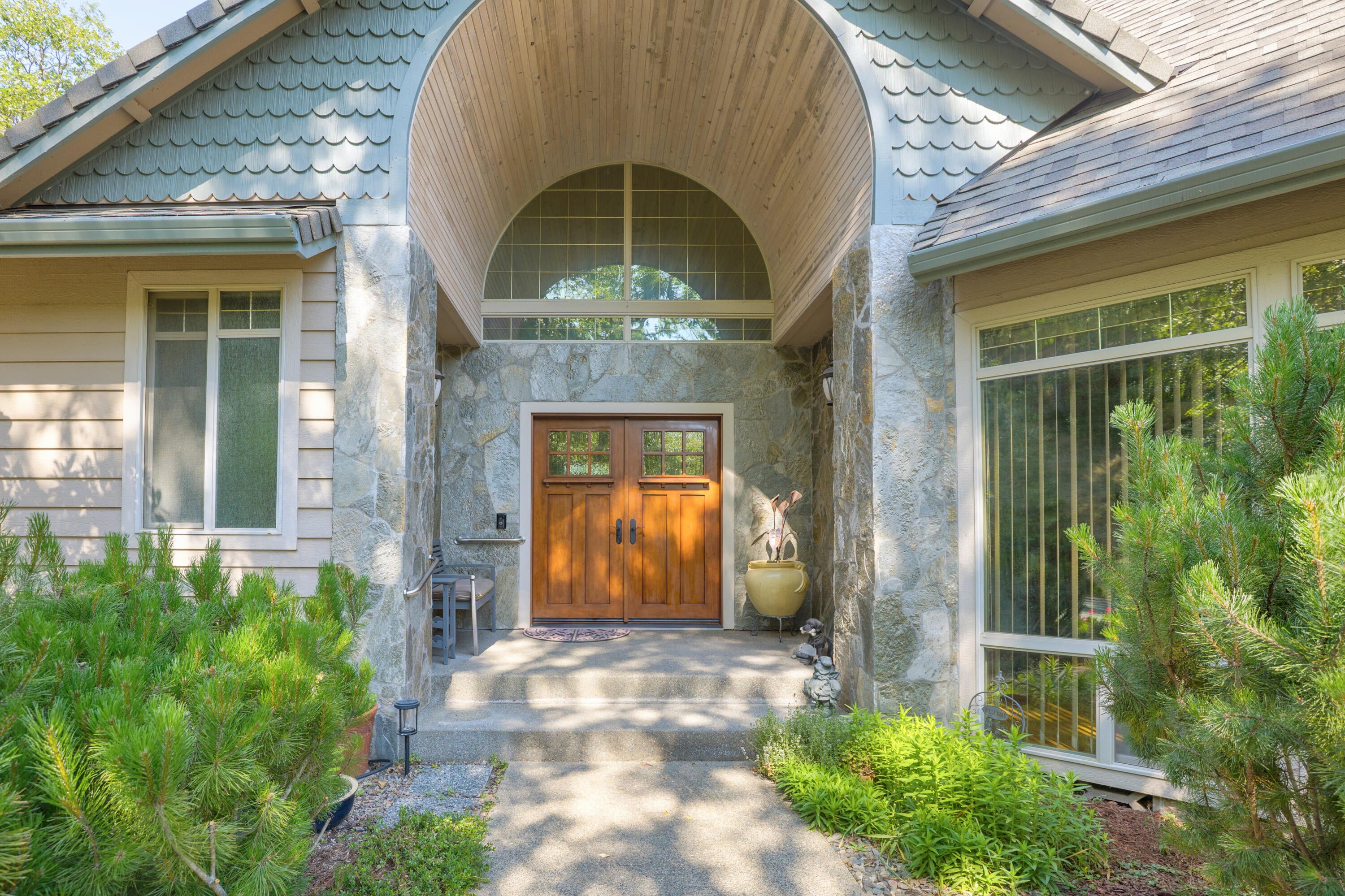 5668 Upper River Road Grants Pass, OR 97526 - Photo 1 of 50 Slate stone entrance with custom barrel ceiling, double doors and custom windows and lights