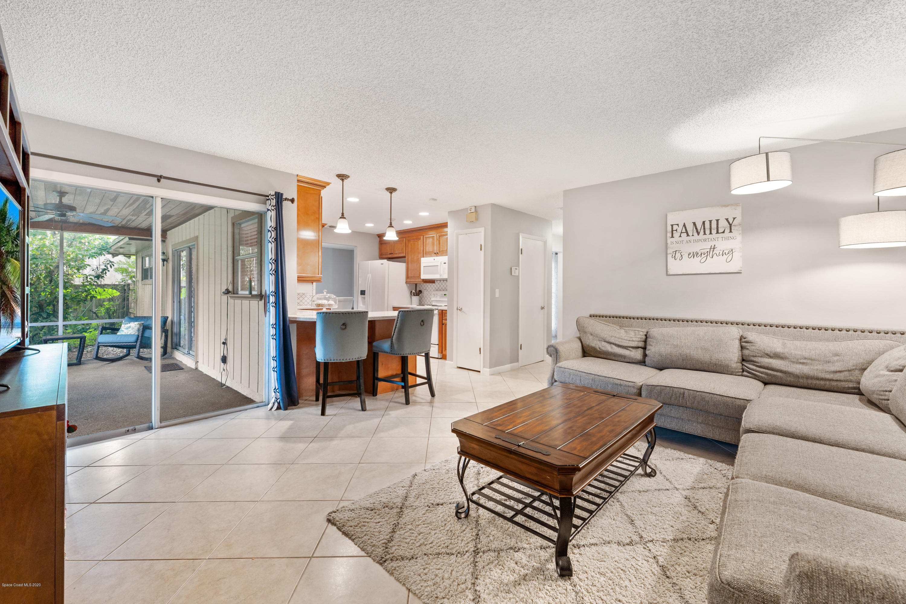 1540 Van Eck Road Northeast Palm Bay, FL 32907 - Photo 14 of 29 12 family room kitchen view