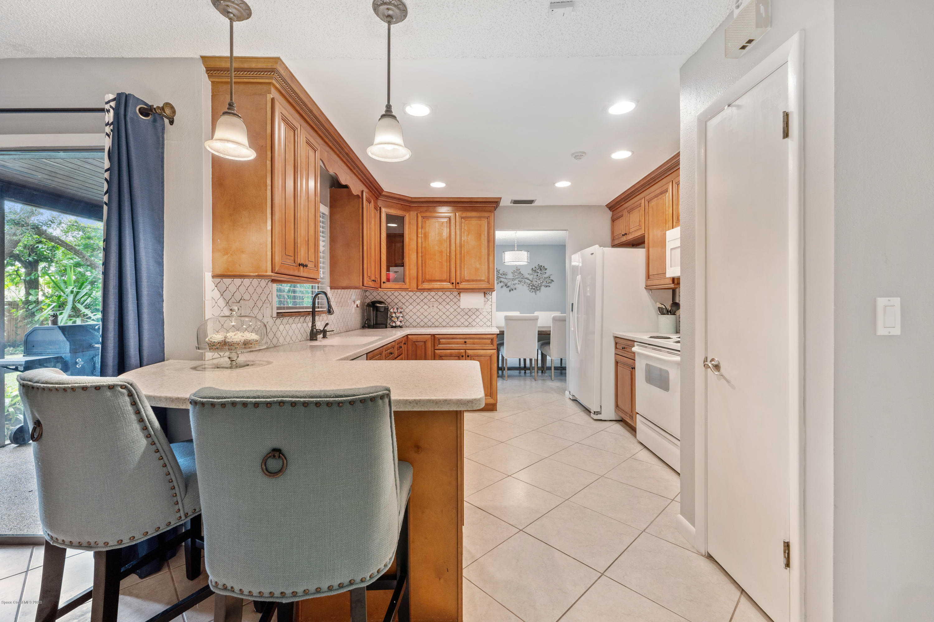 1540 Van Eck Road Northeast Palm Bay, FL 32907 - Photo 10 of 29 8 kitchen view breakfast bar