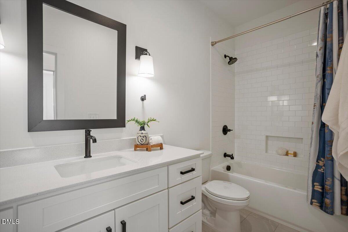 6419 Tanner Oak Lane Raleigh, NC 27613 - Photo 32 of 39 a bathroom with a sink toilet and shower