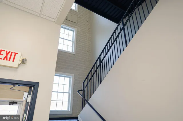 a view of staircase with wooden floor and staircase
