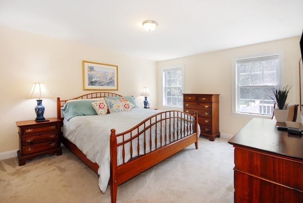 17 Marble Farm Road, Unit 17 Maynard, MA 01754 - Photo 14 of 26 a bedroom with a bed and a night stand