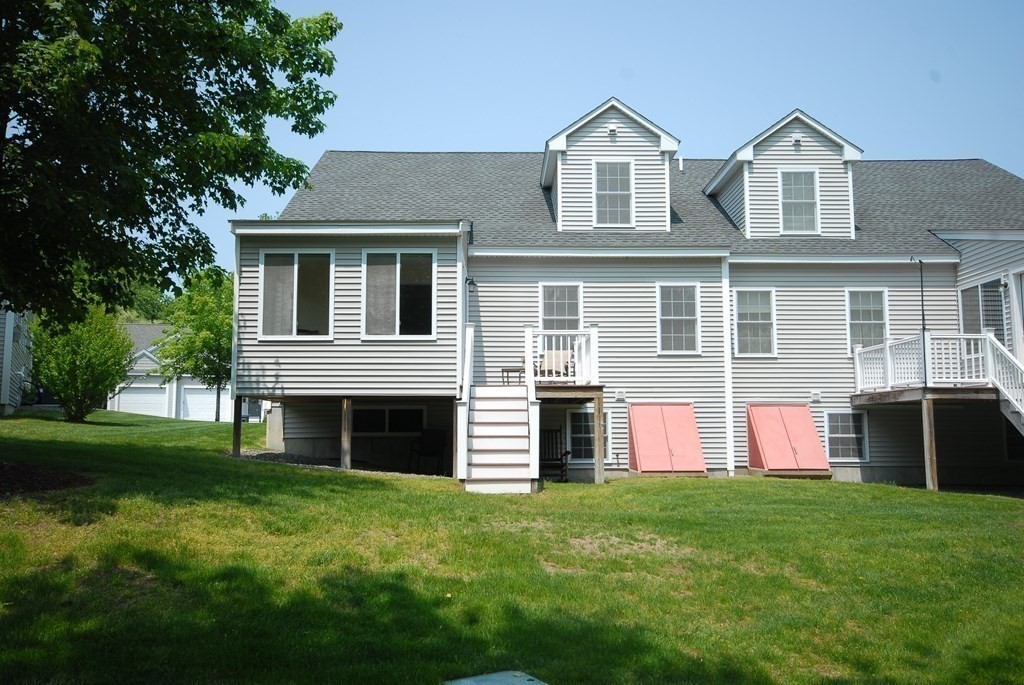17 Marble Farm Road, Unit 17 Maynard, MA 01754 - Photo 23 of 26 a front view of a house with a yard
