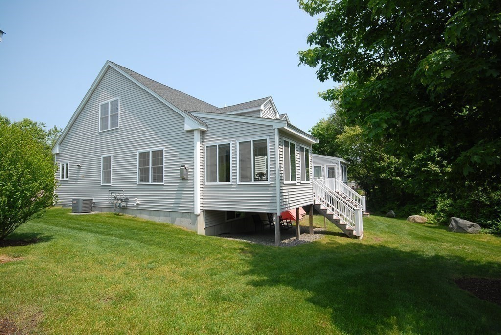 17 Marble Farm Road, Unit 17 Maynard, MA 01754 - Photo 25 of 26 a house view with a garden space