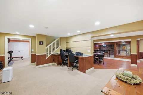 a room with lots of chairs and mirrors