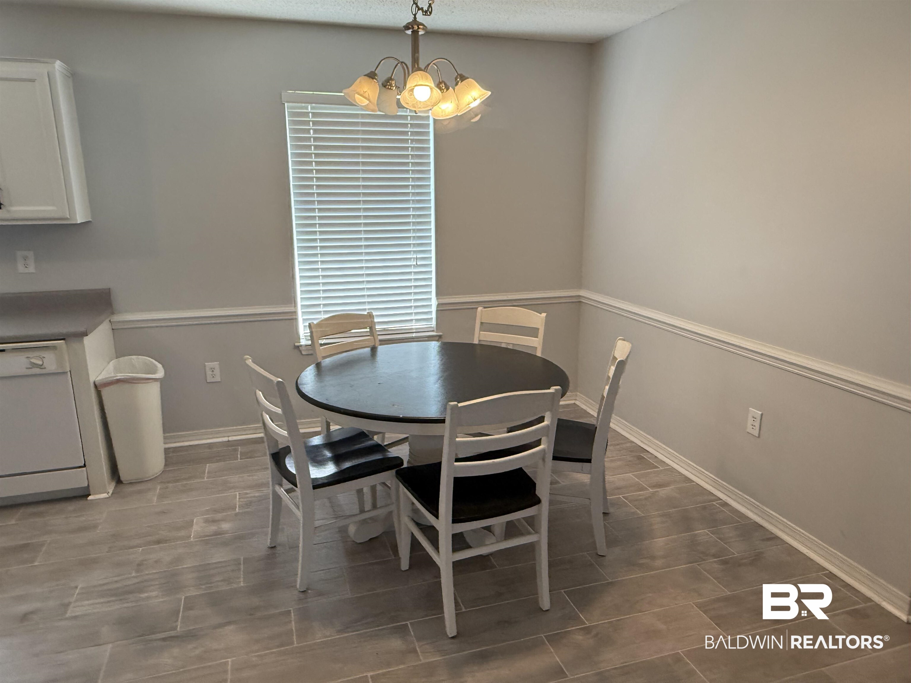 12932 Hopper Road Summerdale, AL 36580 - Photo 4 of 18 Dining area featuring a chandelier and baseboards