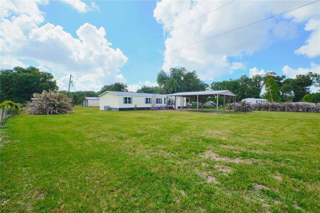 2701 Murphy Road Ona, FL 33865 - Photo 38 of 41 a view of a house with a big yard and large trees