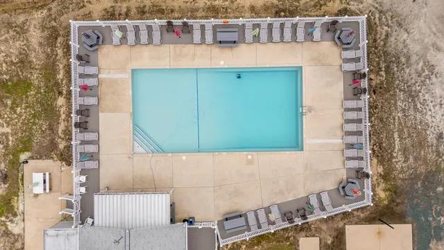 a view of a small house with roof deck