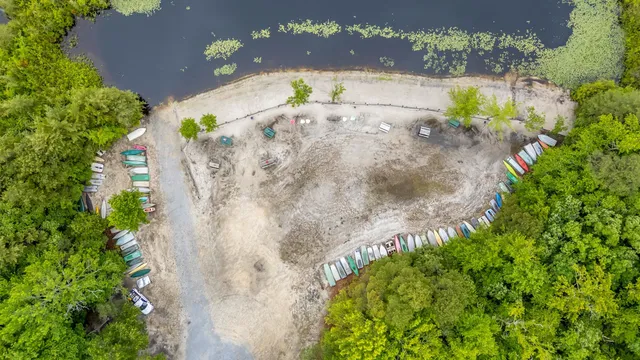 an aerial view of a house with a yard and a garden