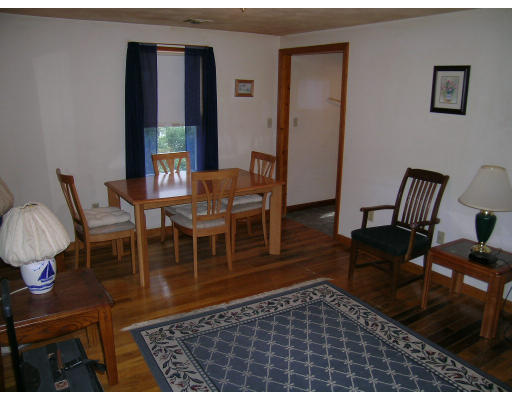 232 Pleasant Street Melrose, MA 02176 - Photo 2 of 8 a living room with furniture rug and wooden floor