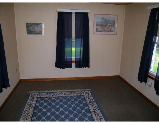 232 Pleasant Street Melrose, MA 02176 - Photo 5 of 8 an empty room with wooden floor and a flat screen tv