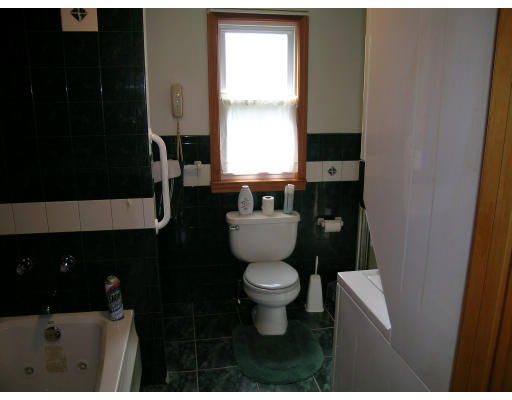 232 Pleasant Street Melrose, MA 02176 - Photo 6 of 8 a bathroom with a sink and a toilet