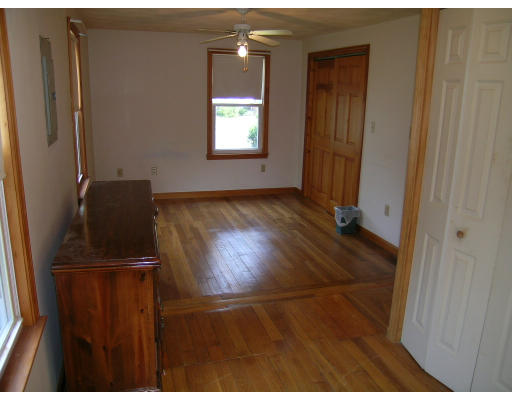 232 Pleasant Street Melrose, MA 02176 - Photo 7 of 8 a view of empty room with wooden floor and cabinet