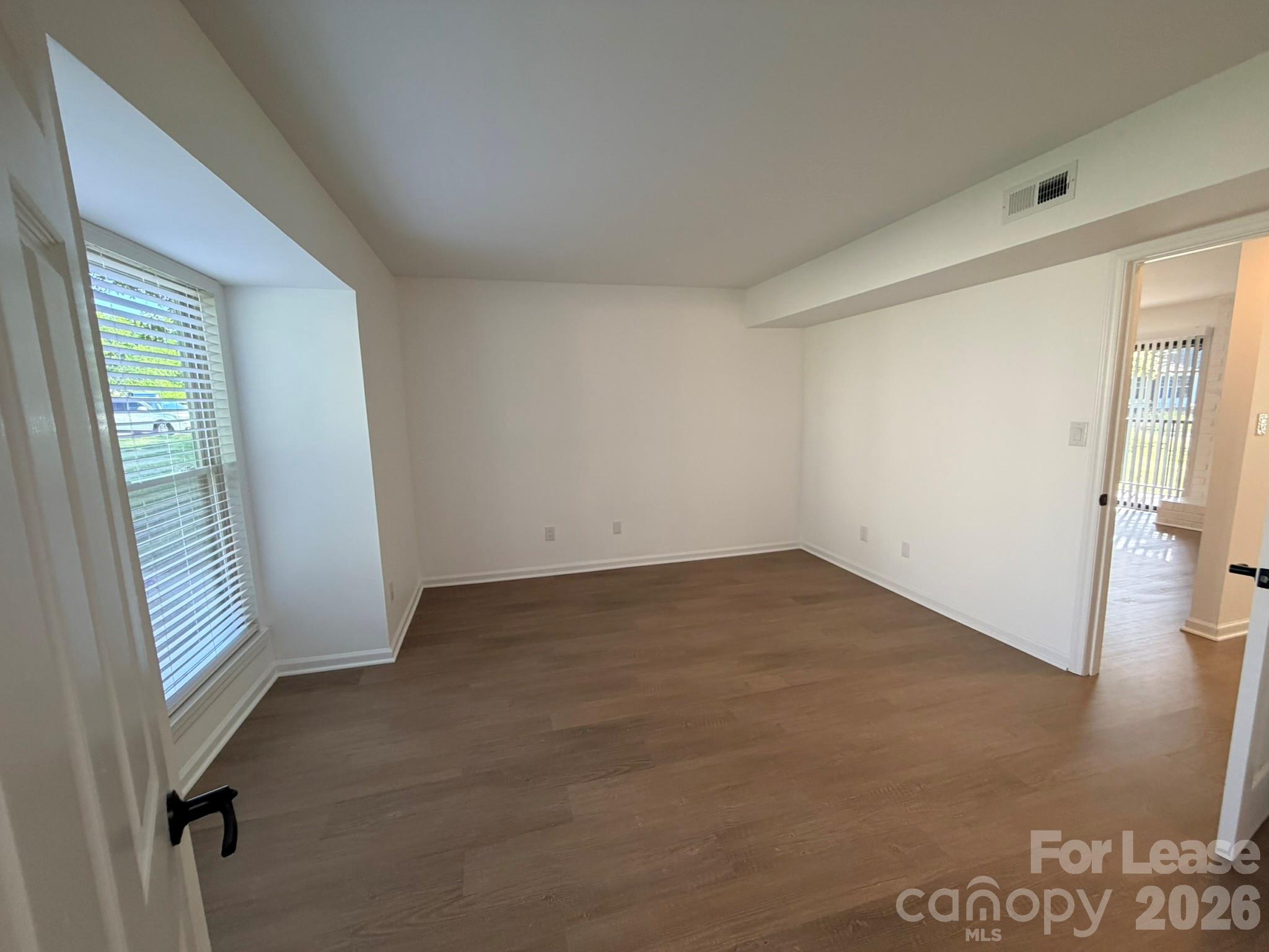 11048 Cedar View Road Charlotte, NC 28226 - Photo 5 of 8 an empty room with windows