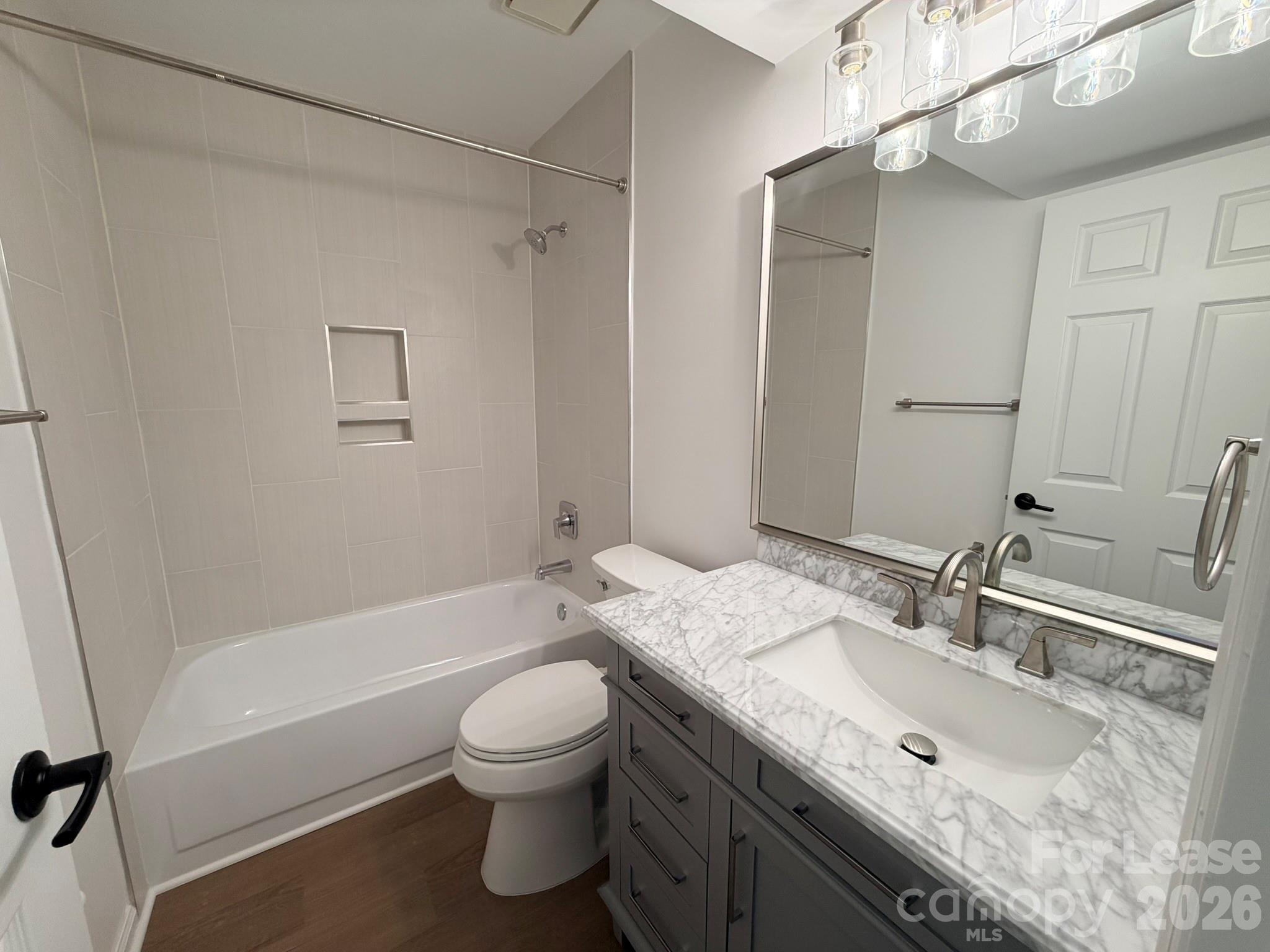 11048 Cedar View Road Charlotte, NC 28226 - Photo 8 of 8 a bathroom with a granite countertop sink toilet and shower
