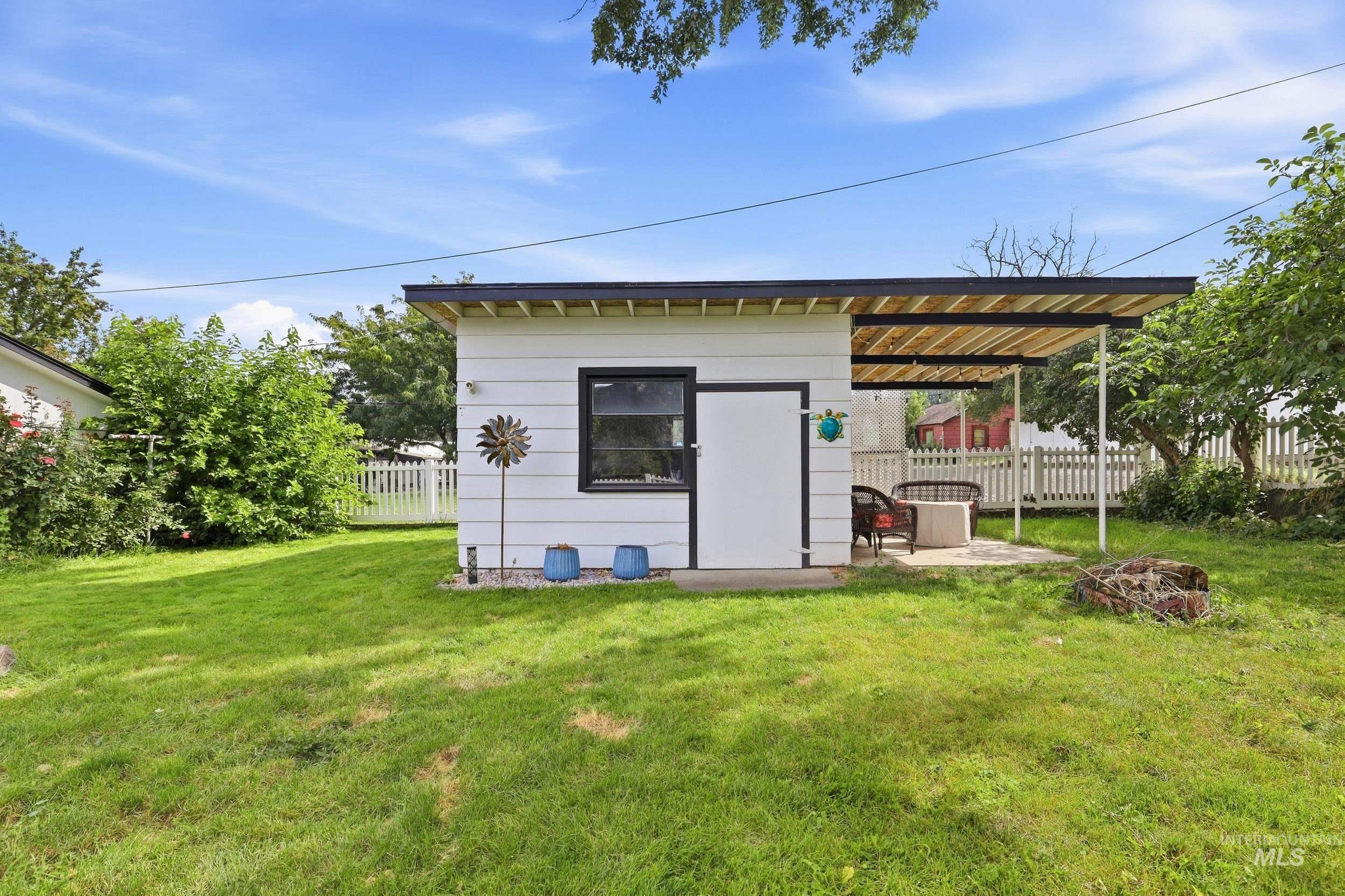 1803 14th Street Lewiston, ID 83501 - Photo 4 of 27 Detached structure with horizontal siding, a covered patio, and a fenced perimeter
