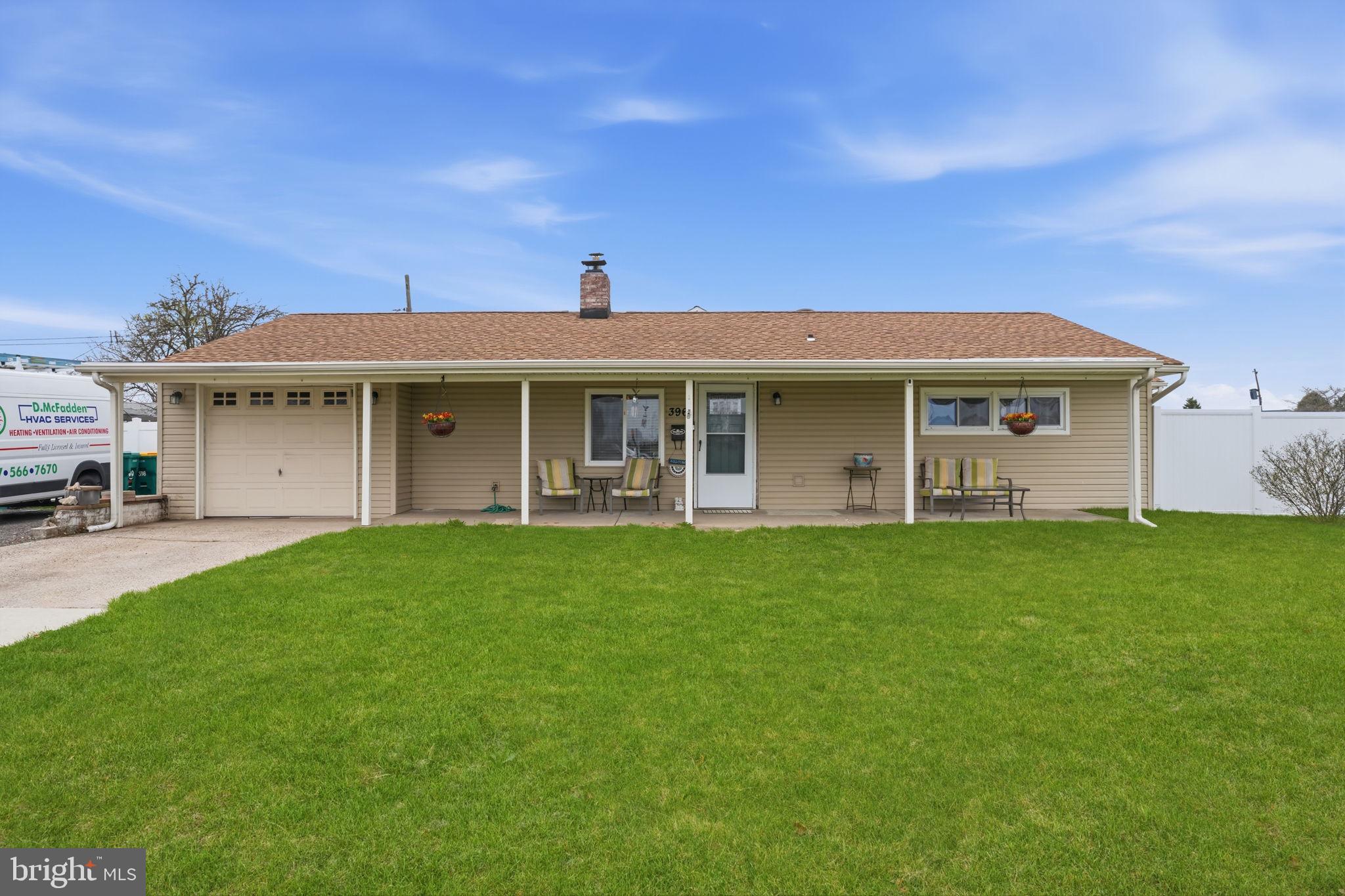 396 Pinewood Drive Levittown, PA 19054 - Photo 1 of 32 a front view of a house with a garden