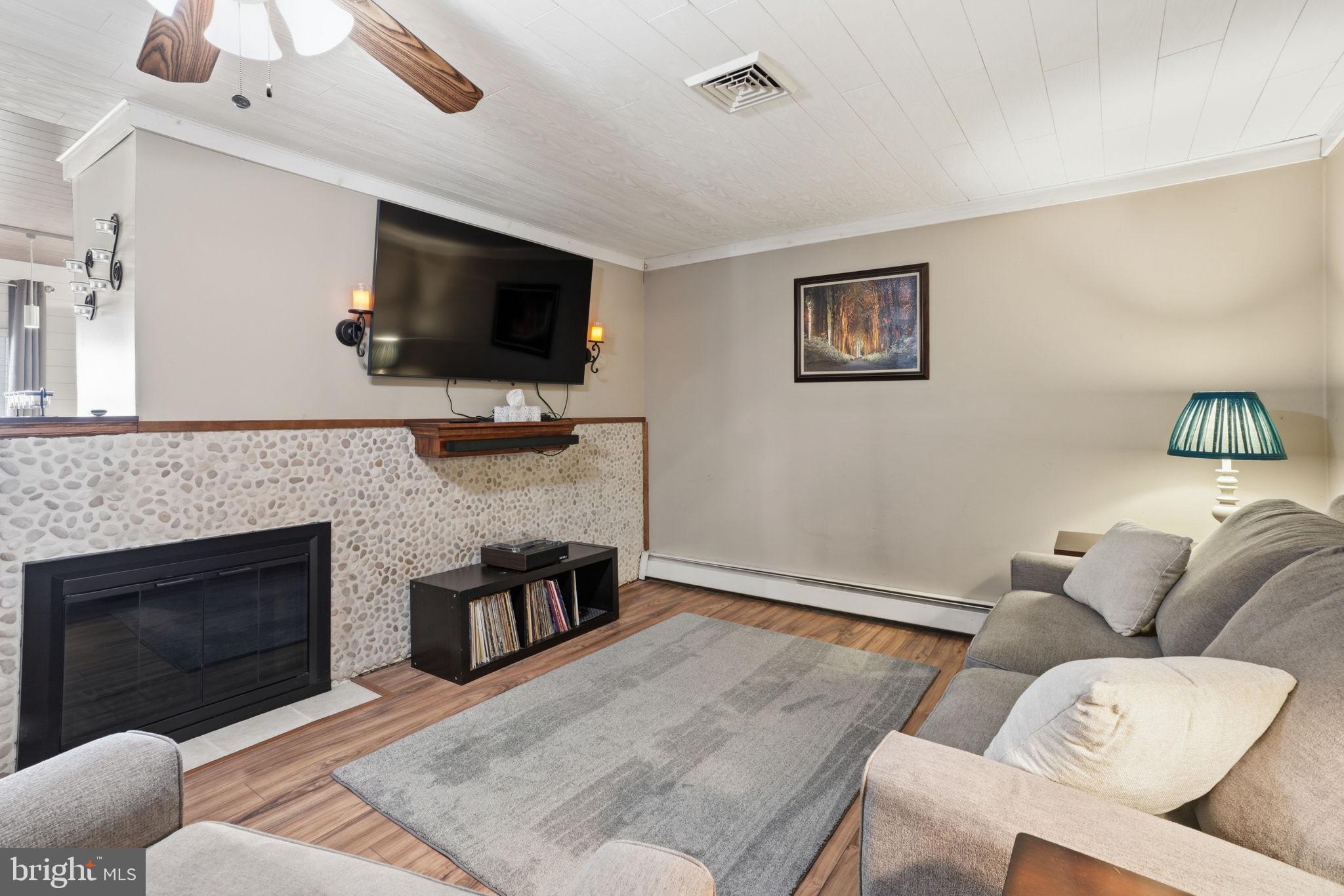 396 Pinewood Drive Levittown, PA 19054 - Photo 11 of 32 a living room with furniture and a flat screen tv
