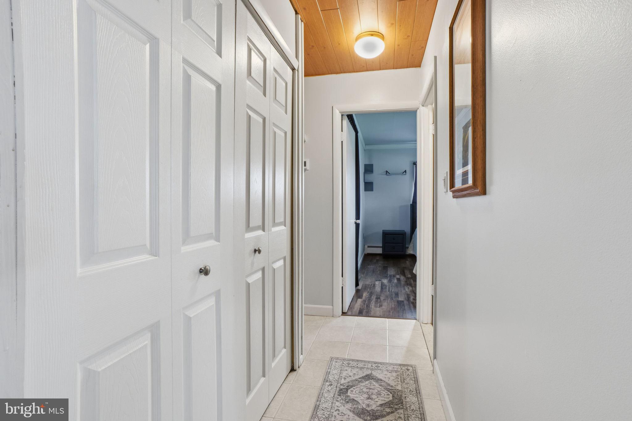 396 Pinewood Drive Levittown, PA 19054 - Photo 20 of 32 a view of a hallway with a dining area