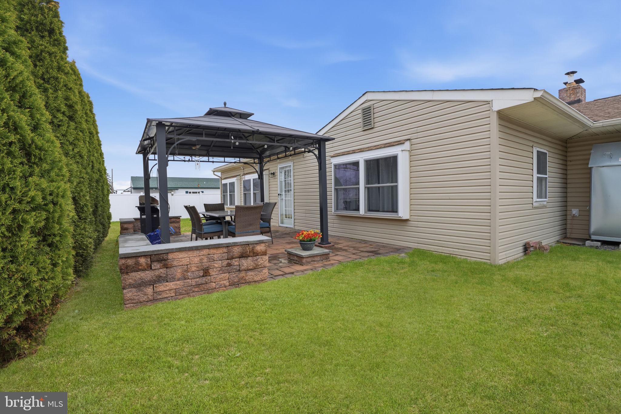 396 Pinewood Drive Levittown, PA 19054 - Photo 25 of 32 a view of a house with backyard and porch