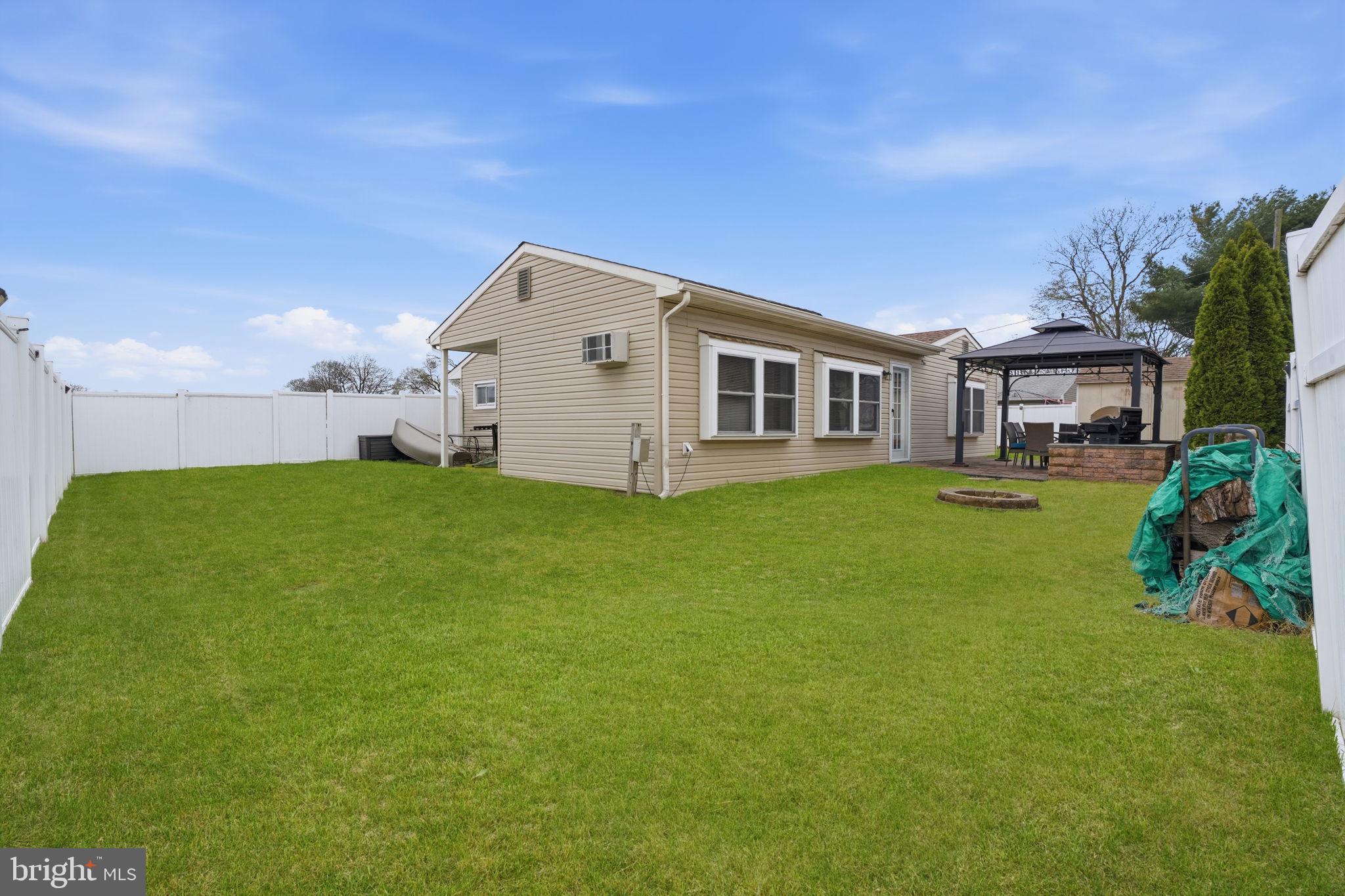 396 Pinewood Drive Levittown, PA 19054 - Photo 29 of 32 a big house with a big yard and large trees