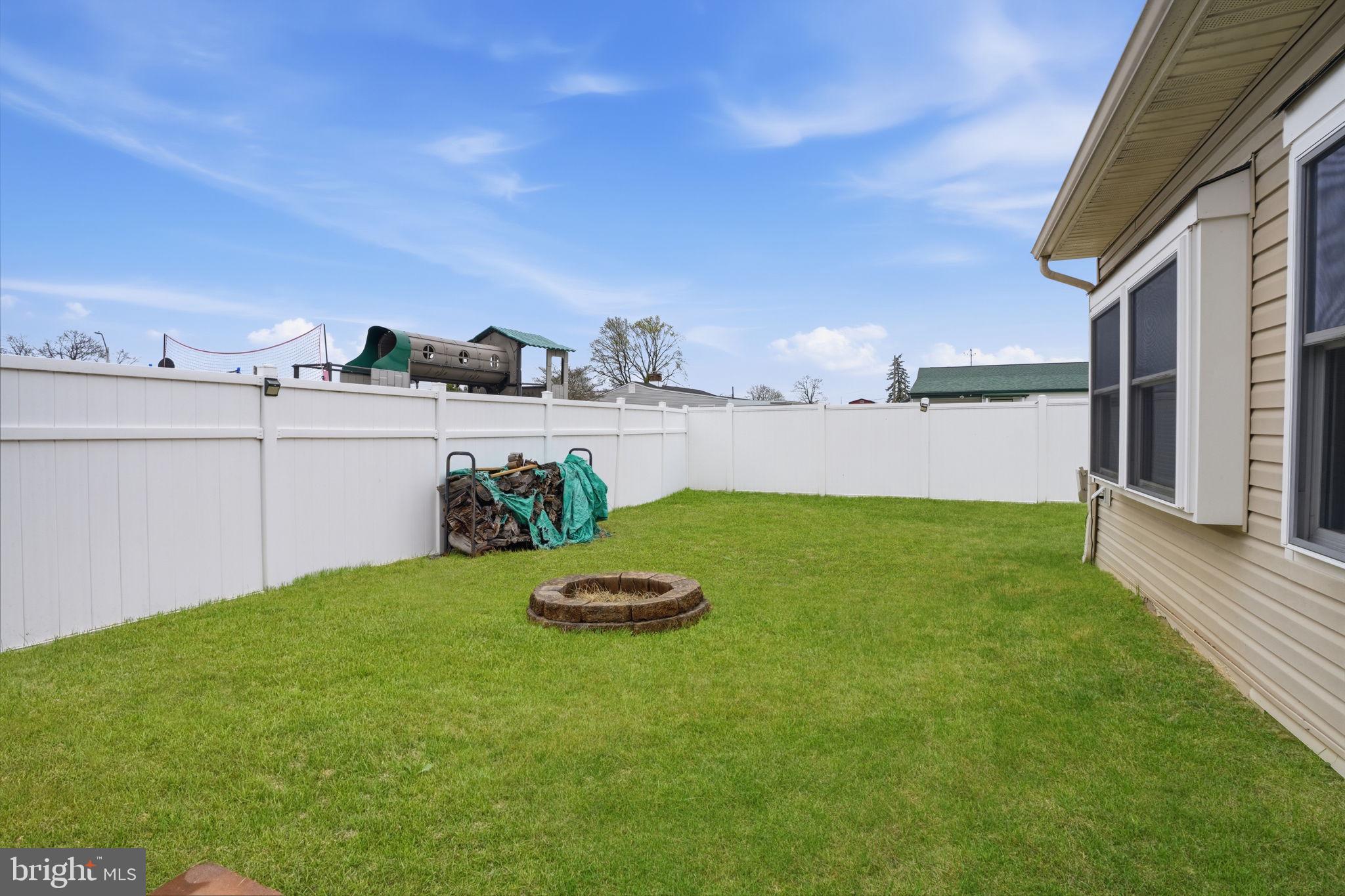 396 Pinewood Drive Levittown, PA 19054 - Photo 31 of 32 a view of a backyard with table and chairs