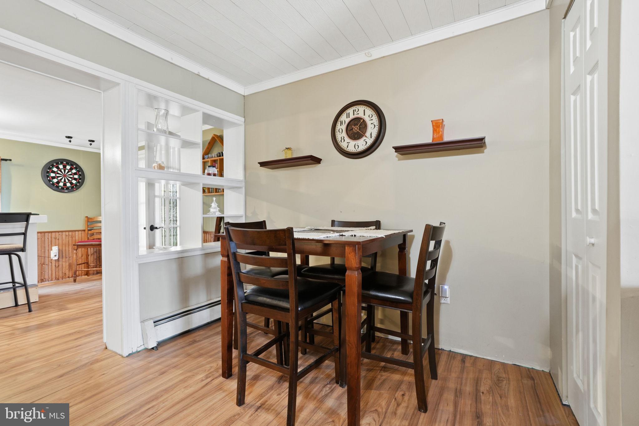 396 Pinewood Drive Levittown, PA 19054 - Photo 10 of 32 a view of a dining room with furniture and wooden floor