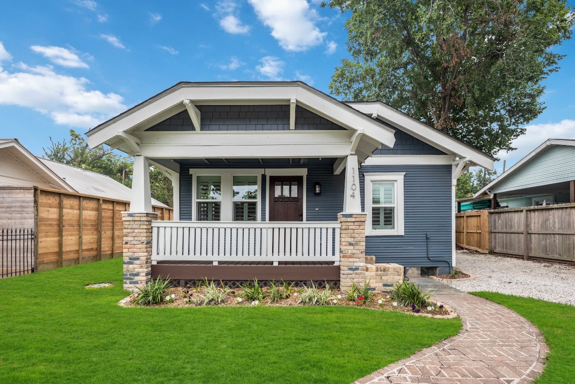Welcome to charming craftsmanship at 1104 Walton St, where classic beauty meets a fully gated haven in the Greater Heights.
