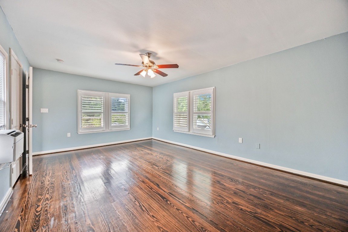 1104 Walton Street Houston, TX 77009 - Photo 18 of 27 A sanctuary spacious enough for a king bed, dressers, and a cozy seating area.