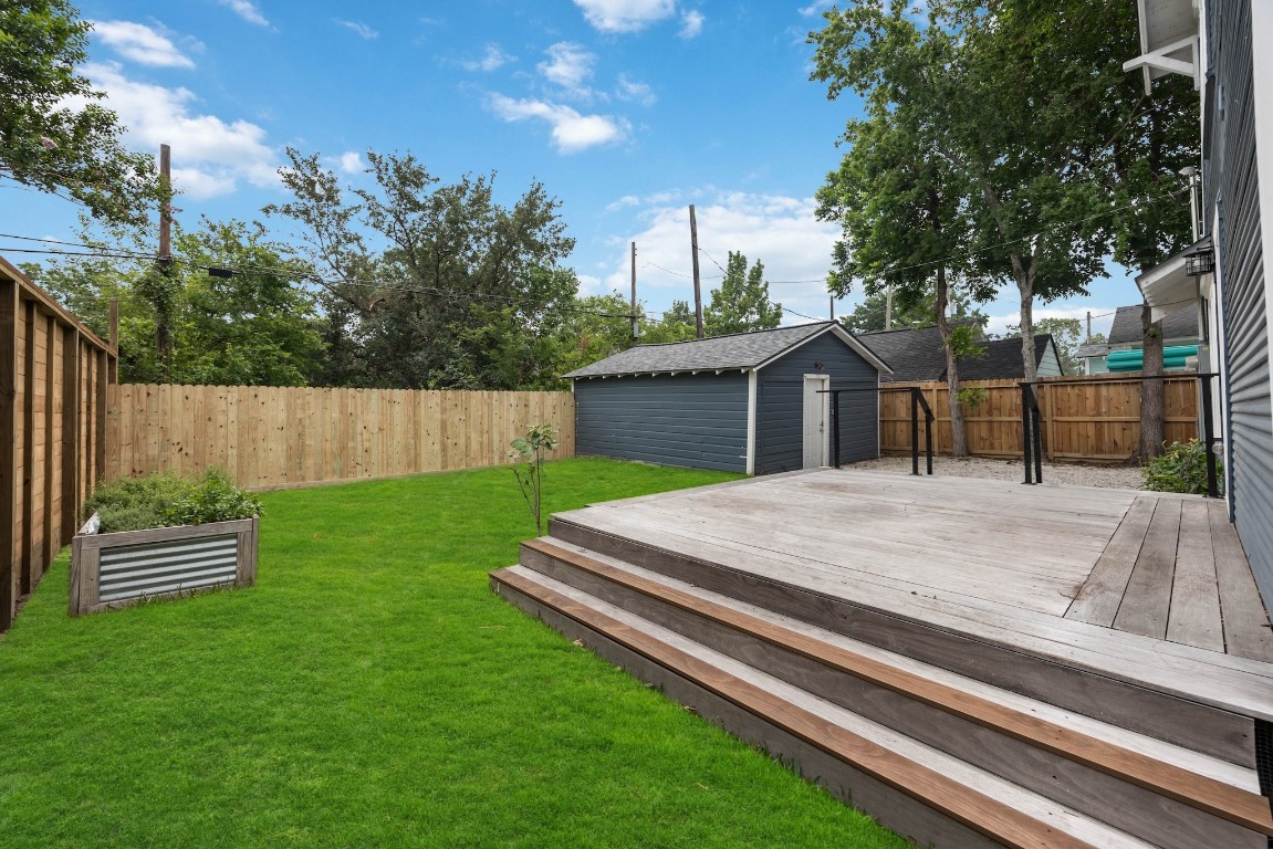 1104 Walton Street Houston, TX 77009 - Photo 24 of 27 Cultivate your green thumb with raised beds, a young fig tree, and a spacious yard ready for exploration.