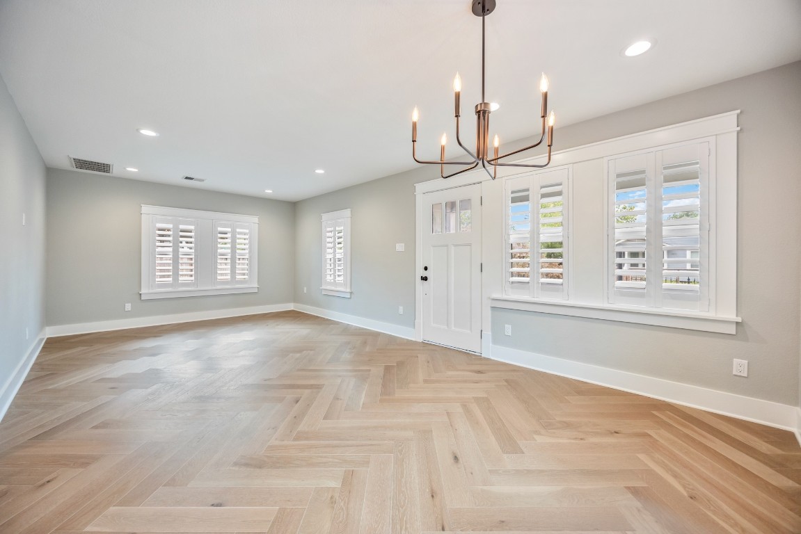 1104 Walton Street Houston, TX 77009 - Photo 3 of 27 Bask in the warmth of light neutral tones, stunning Herringbone wood floors, and thoughtful touches like plantation shutters and recessed LED lighting in the flowing living/dining spaces.
