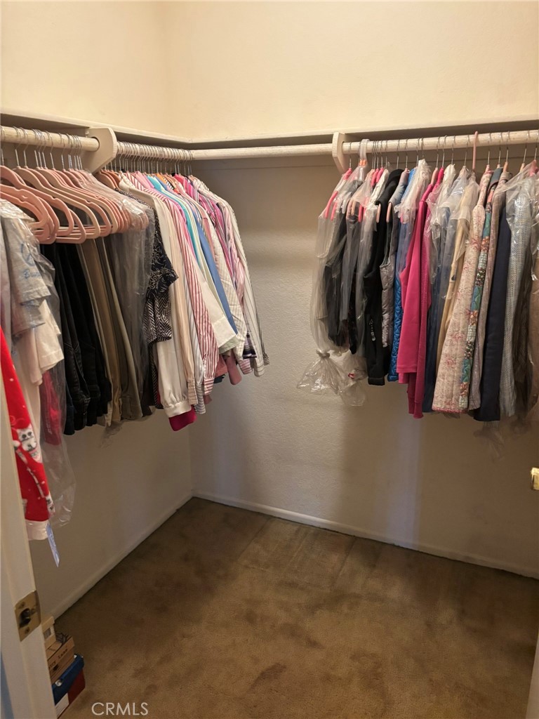 15809 Fallen Leaf Road La Puente, CA 91744 - Photo 20 of 23 a view of walk in closet with clothes and shoes