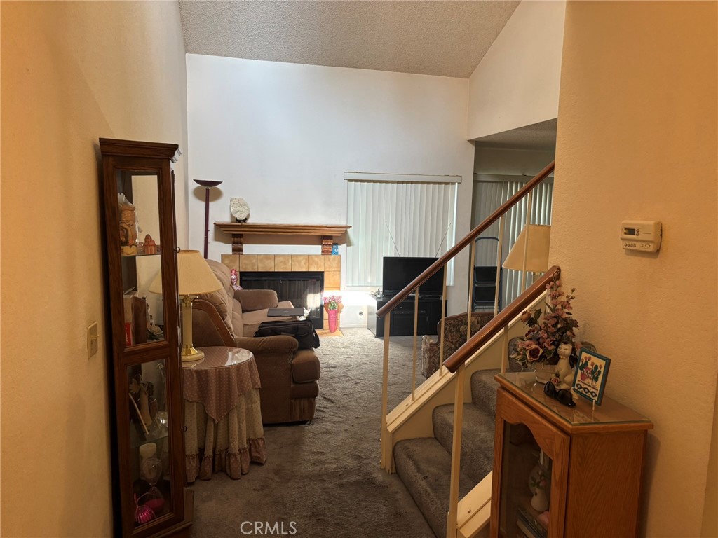 15809 Fallen Leaf Road La Puente, CA 91744 - Photo 2 of 23 a living room with furniture and a flat screen tv