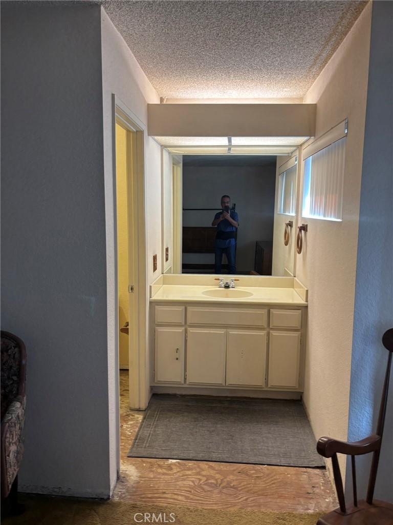 15809 Fallen Leaf Road La Puente, CA 91744 - Photo 23 of 23 a bathroom with a sink and a mirror