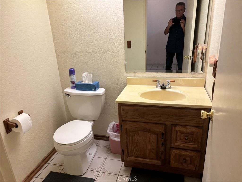 15809 Fallen Leaf Road La Puente, CA 91744 - Photo 3 of 23 a bathroom with a toilet sink and mirror