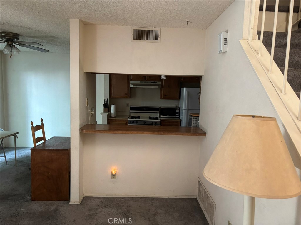 15809 Fallen Leaf Road La Puente, CA 91744 - Photo 6 of 23 a living room with furniture and a flat screen tv