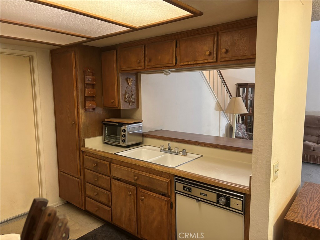 15809 Fallen Leaf Road La Puente, CA 91744 - Photo 9 of 23 a kitchen with a sink and cabinets