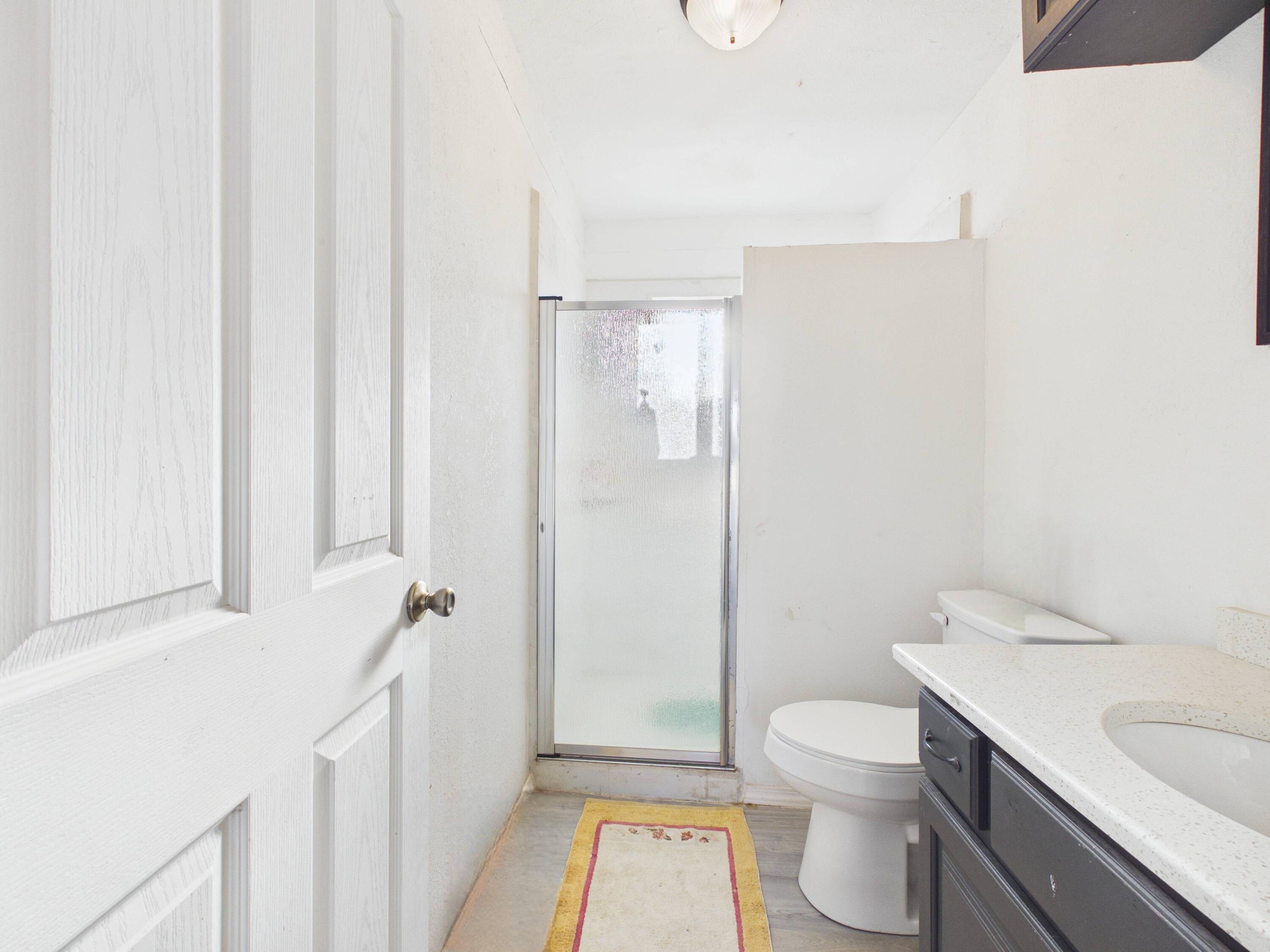 2804 Vanda Avenue Lubbock, TX 79404 - Photo 12 of 23 a bathroom with a sink a toilet and shower