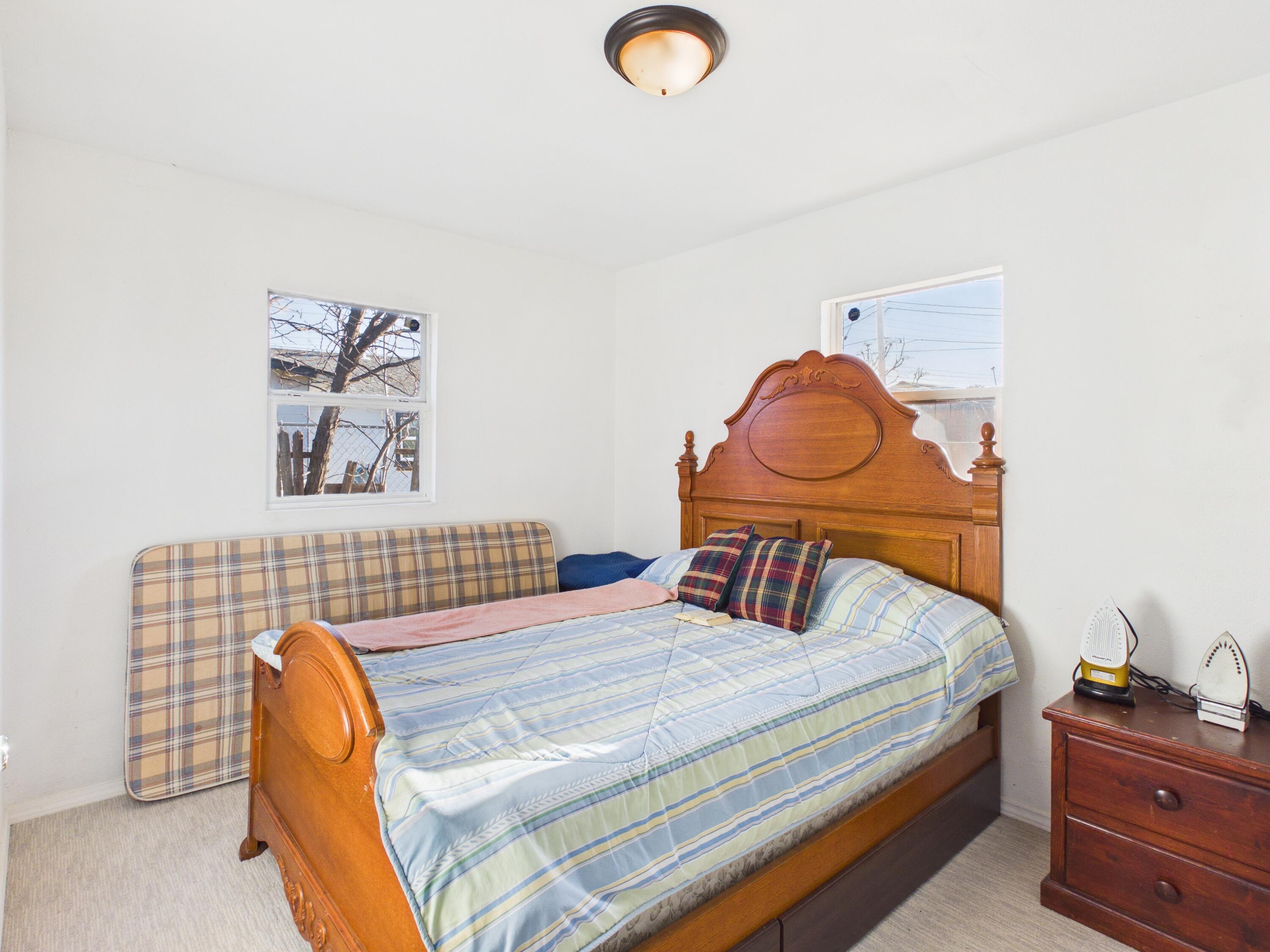 2804 Vanda Avenue Lubbock, TX 79404 - Photo 16 of 23 a bedroom with a bed and dresser