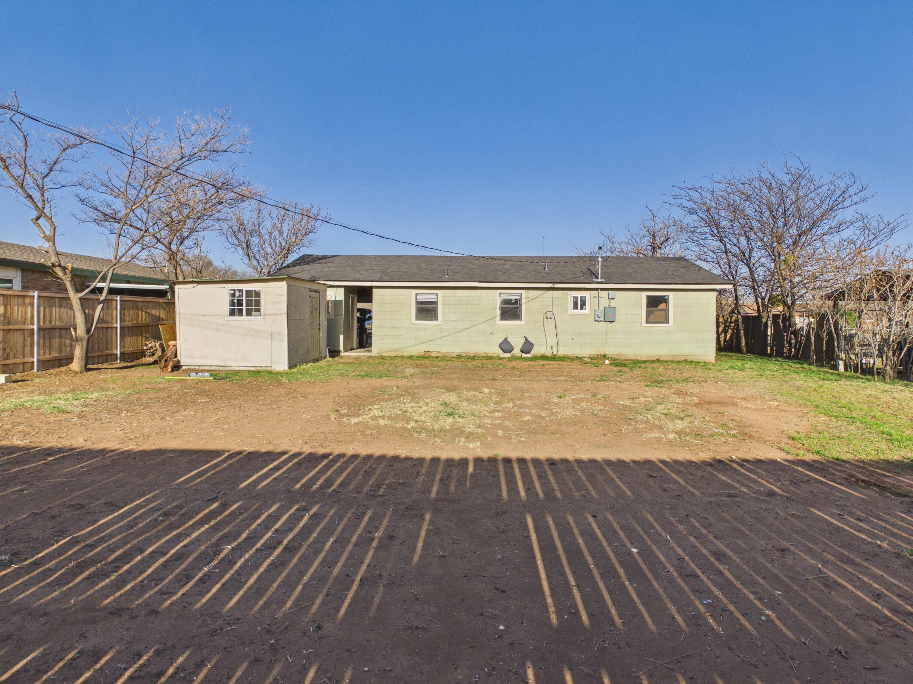 2804 Vanda Avenue Lubbock, TX 79404 - Photo 19 of 23 a view of a house with a yard