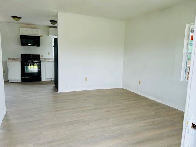 2804 Vanda Avenue Lubbock, TX 79404 - Photo 2 of 5 a view of empty room with a fireplace