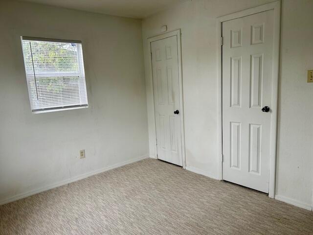 2804 Vanda Avenue Lubbock, TX 79404 - Photo 3 of 5 an empty room with wooden floor and windows