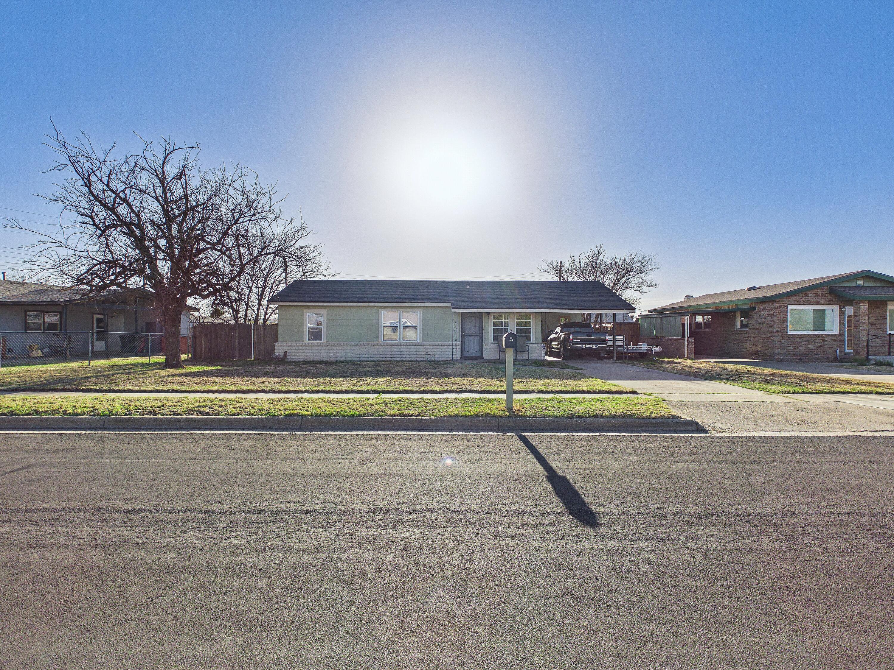 2804 Vanda Avenue Lubbock, TX 79404 - Photo 5 of 23 a view of a swimming pool with an outdoor space and seating area