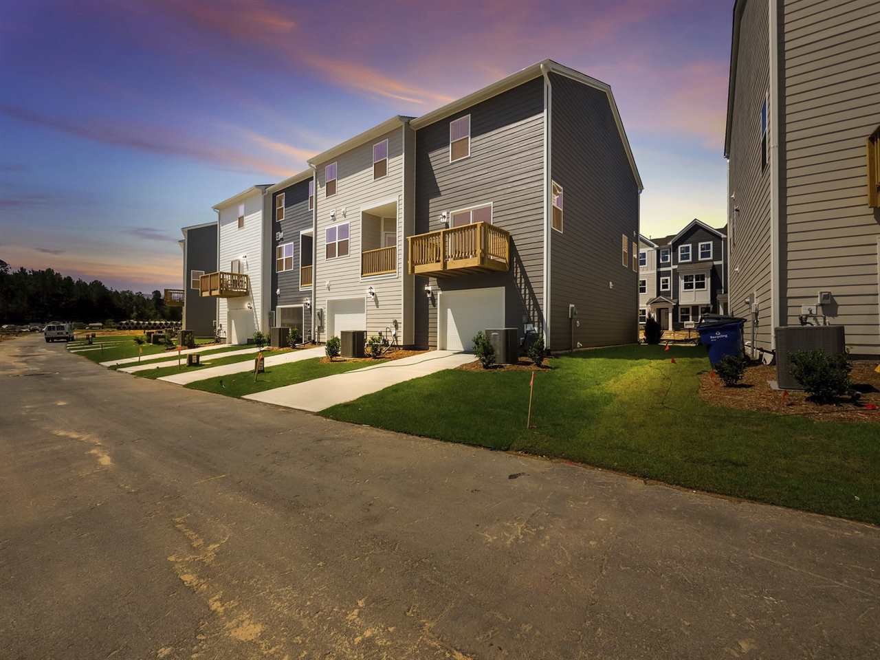 6311 Perry Creek Road, Unit 2301 Raleigh, NC 27616 - Photo 2 of 27 Photos are not of actual home but are provided to show exterior outdoor balcony and garage location on townhomes