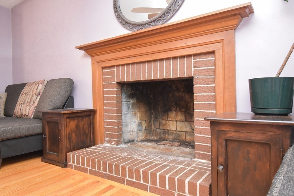 128 Tioga Street Springfield, MA 01128 - Photo 13 of 33 a bedroom with a bed and a television