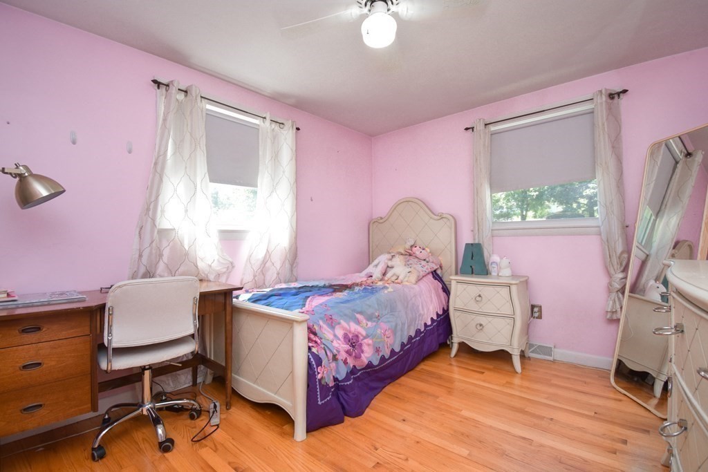 128 Tioga Street Springfield, MA 01128 - Photo 17 of 33 a bedroom with a bed closet and a window